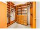 Large walk-in closet featuring custom drawers, shelving and enclosed glass display cases at 2877 Paradise Rd # 702, Las Vegas, NV 89109