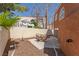 Private backyard featuring a patio with table and chairs and a view of a white pergola at 3221 Epson St, Las Vegas, NV 89129