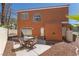 Private backyard featuring a patio with table and chairs and a sliding door at 3221 Epson St, Las Vegas, NV 89129