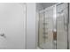 Bright bathroom featuring a shower with glass doors and chrome fixtures at 3221 Epson St, Las Vegas, NV 89129