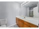 This bathroom offers a wood vanity with generous counter space and a walk-in shower at 3221 Epson St, Las Vegas, NV 89129