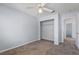 Bedroom featuring carpet flooring, a ceiling fan, a closet and open entry into the hallway at 3221 Epson St, Las Vegas, NV 89129