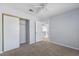 Bedroom with carpet flooring, closet with sliding doors and an open entry into the hallway at 3221 Epson St, Las Vegas, NV 89129