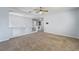 Upstairs bonus room with carpet, ceiling fan, pendant light, and staircase access at 3221 Epson St, Las Vegas, NV 89129