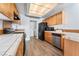Kitchen with tile countertops and black appliances near laundry area at 3221 Epson St, Las Vegas, NV 89129
