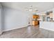 Open concept kitchen with wood cabinets and laminate flooring at 3221 Epson St, Las Vegas, NV 89129
