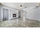 Bright and airy living room featuring a fireplace, staircase to the second floor, and tile flooring at 3221 Epson St, Las Vegas, NV 89129
