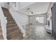 Bright living room with tiled floor, ceiling fan, and staircase at 3221 Epson St, Las Vegas, NV 89129