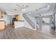 Open layout showing the kitchen, staircase, and living room at 3221 Epson St, Las Vegas, NV 89129