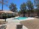Community pool area with lounge chairs and desert landscaping on a sunny day at 3221 Epson St, Las Vegas, NV 89129