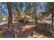 Community walkway featuring a wrought iron fence and mature trees and shrubbery at 3221 Epson St, Las Vegas, NV 89129