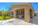 Covered patio featuring a built-in spa with outdoor furnishings overlooking the green yard at 3709 Corte Bella Hills Ave, North Las Vegas, NV 89081