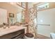 Bathroom featuring a shower-tub combo and dark wood vanity with white basin sink at 3709 Corte Bella Hills Ave, North Las Vegas, NV 89081