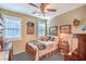 Cozy bedroom featuring a twin bed, shutters, soft lighting, and decorative artwork for a warm atmosphere at 3709 Corte Bella Hills Ave, North Las Vegas, NV 89081