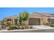 Charming single-story home featuring a two-car garage, desert landscaping, and a cozy front porch area at 3709 Corte Bella Hills Ave, North Las Vegas, NV 89081