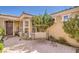 Inviting front patio with brick paving, a swing, and cozy decor at 3709 Corte Bella Hills Ave, North Las Vegas, NV 89081