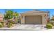 Charming single-story home featuring a two-car garage and desert landscaping at 3709 Corte Bella Hills Ave, North Las Vegas, NV 89081