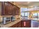 Granite counters and stainless appliances in this well-appointed kitchen at 3709 Corte Bella Hills Ave, North Las Vegas, NV 89081