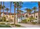 Pool area surrounded by walkways, palm trees, and a fence at 3709 Corte Bella Hills Ave, North Las Vegas, NV 89081