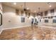 Studio space with hardwood floors, mirrors, windows, and suspended ceiling fans and lights at 3709 Corte Bella Hills Ave, North Las Vegas, NV 89081