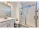 Modern bathroom with glass walk-in shower, vanity, and sleek fixtures at 397 Pearl Fountains Ct, Las Vegas, NV 89148