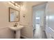 Bathroom featuring sink with vanity, decorative lighting, and access to other rooms at 397 Pearl Fountains Ct, Las Vegas, NV 89148