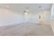 Large, carpeted bedroom with recessed lighting, light walls, and adjoining bathroom and walk-in closet at 397 Pearl Fountains Ct, Las Vegas, NV 89148
