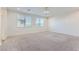 Spacious bedroom featuring plush carpeting, recessed lighting, and natural light from two large, window at 397 Pearl Fountains Ct, Las Vegas, NV 89148