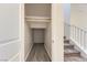 Hallway closet that leads to the staircase with carpeted steps and white railing at 397 Pearl Fountains Ct, Las Vegas, NV 89148