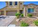 Beautiful two-story home with a three car garage and brick paver driveway at 397 Pearl Fountains Ct, Las Vegas, NV 89148