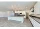 Modern kitchen with a center island, stainless steel appliances, and a view to the backyard at 397 Pearl Fountains Ct, Las Vegas, NV 89148