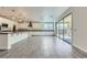 Large open kitchen with a center island, stainless steel appliances, pendant lighting, and sliding door access to the backyard at 397 Pearl Fountains Ct, Las Vegas, NV 89148