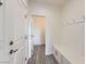 A functional mudroom features stylish tile flooring, a bench, and wainscoting at 397 Pearl Fountains Ct, Las Vegas, NV 89148
