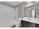 Well-lit bathroom featuring a shower-tub combo, modern vanity, and neutral color palette at 412 Carlton Kay Pl, Las Vegas, NV 89144