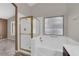 Bathroom featuring a bathtub with gold trim and a shower at 412 Carlton Kay Pl, Las Vegas, NV 89144