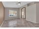 Comfortable bedroom featuring tile flooring, a ceiling fan, and an arched doorway to another room at 412 Carlton Kay Pl, Las Vegas, NV 89144