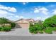 Charming single-story home with a well-maintained front yard and a two-car garage at 412 Carlton Kay Pl, Las Vegas, NV 89144