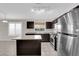 Eat-in kitchen with tile floors, center island, and stainless appliances at 412 Carlton Kay Pl, Las Vegas, NV 89144