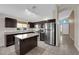 Modern kitchen boasts stainless appliances and a view of the front yard at 412 Carlton Kay Pl, Las Vegas, NV 89144