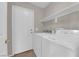 Neutral-toned laundry room featuring full size washer and dryer at 412 Carlton Kay Pl, Las Vegas, NV 89144