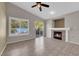 Comfortable living room featuring tile floors and a cozy fireplace at 412 Carlton Kay Pl, Las Vegas, NV 89144