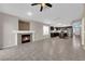 Open-concept living room featuring a fireplace and connecting to the kitchen at 412 Carlton Kay Pl, Las Vegas, NV 89144