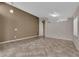 Open-concept living area with tile flooring, neutral paint, and ample natural light at 412 Carlton Kay Pl, Las Vegas, NV 89144