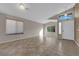 Spacious living room with tile flooring, a vaulted ceiling, and a front door at 412 Carlton Kay Pl, Las Vegas, NV 89144