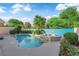 Inviting backyard pool and spa surrounded by mature landscaping and lush greenery at 412 Carlton Kay Pl, Las Vegas, NV 89144