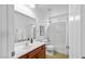 This bathroom features a single vanity, tile floors, and a shower-tub combo at 445 Colorful Rain Ave, North Las Vegas, NV 89031