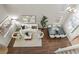 Bird's eye view of a stylish living room featuring a white sofa and dining table with seating at 445 Colorful Rain Ave, North Las Vegas, NV 89031