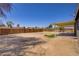 Large, empty backyard, enclosed by a high fence and awaiting landscape design at 4829 Hot Springs Ave, Las Vegas, NV 89110