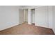 Bedroom featuring neutral carpet and sliding closet adjacent to the entry door at 4829 Hot Springs Ave, Las Vegas, NV 89110
