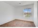 Cozy bedroom with plush carpeting and large window offering natural light at 4829 Hot Springs Ave, Las Vegas, NV 89110